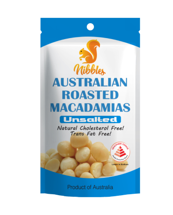 Close-up of roasted macadamia nuts, showcasing their golden-brown exterior and smooth texture, reflecting their crunchy and rich flavor.